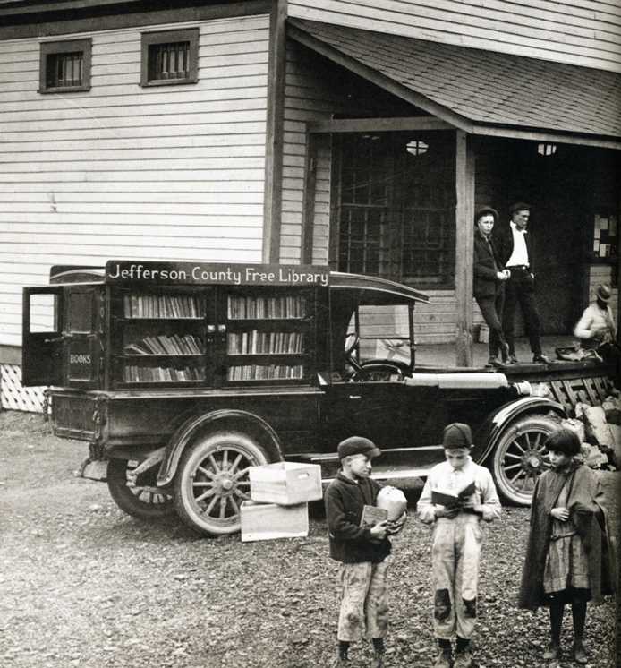 The Free Library bookmobile stops at the Sayre commissary station in the 1920s