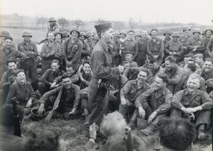 PFC Mickey Rooney entertains infantrymen in Germany, April 1945
